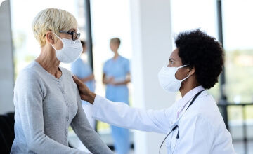Woman receiving an examination in a safe hospital environment